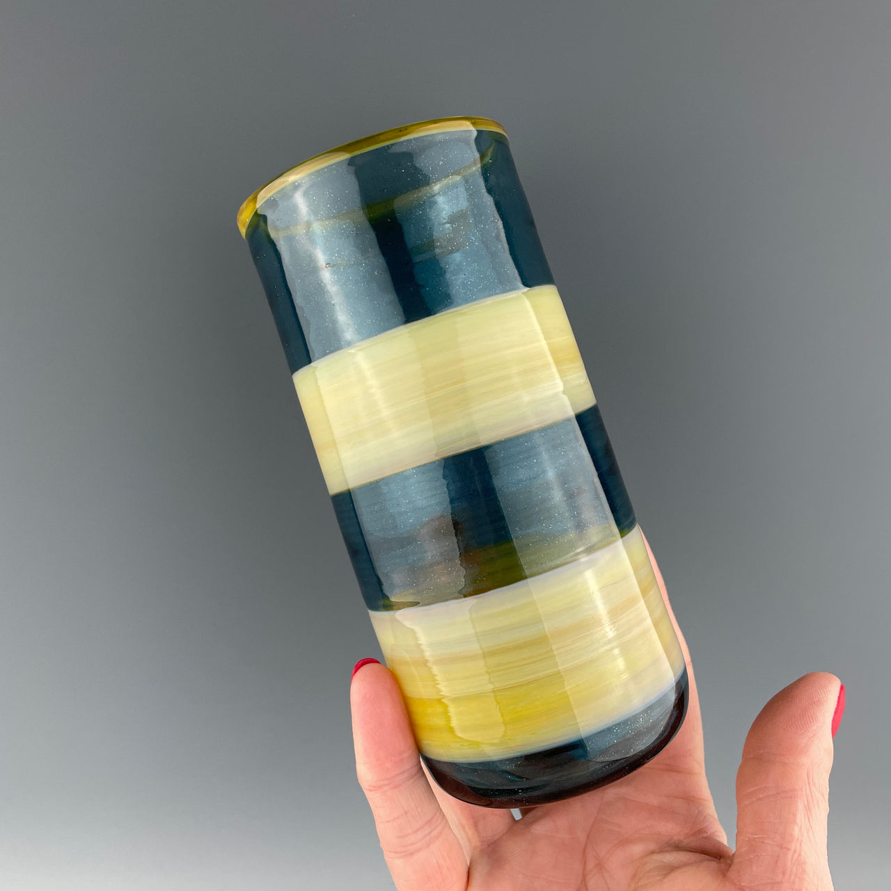 blue and yellow striped cup