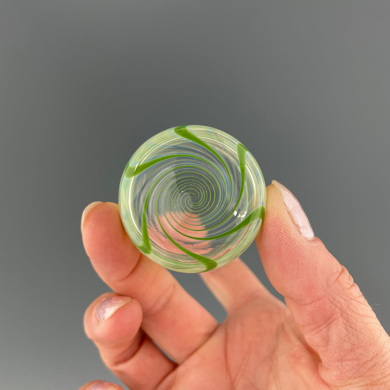 bottom of a clear and green shot glass