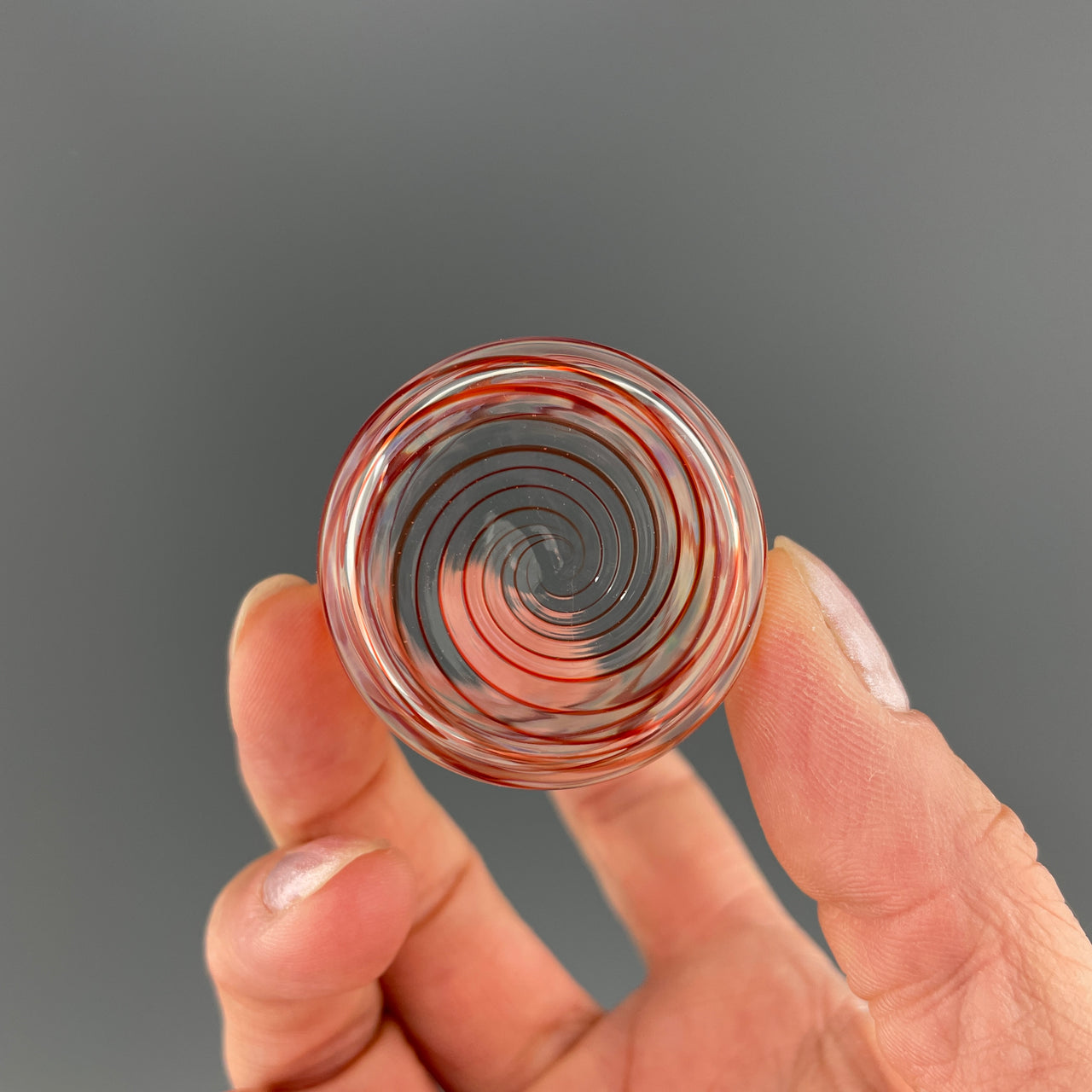 bottom of a clear and red shot glass