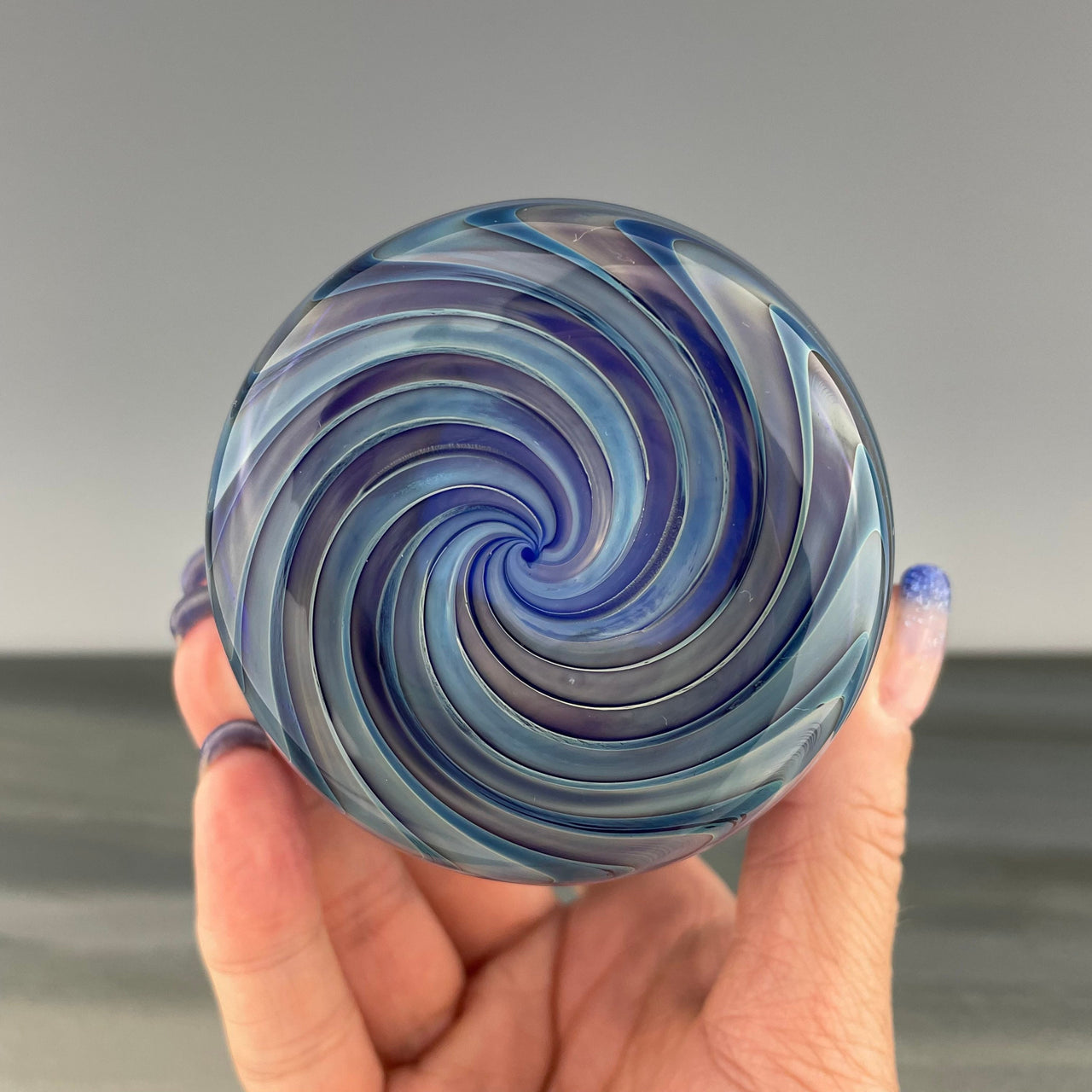 bottom of a cobalt blue cup with a yellow rim