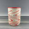 clear cup with red swirls