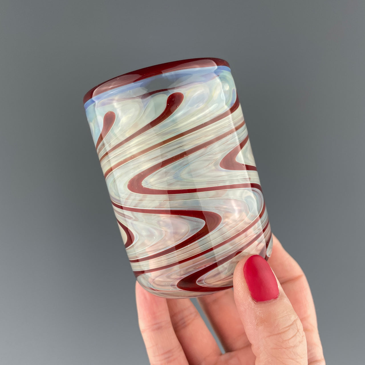 clear cup with ruby red swirls