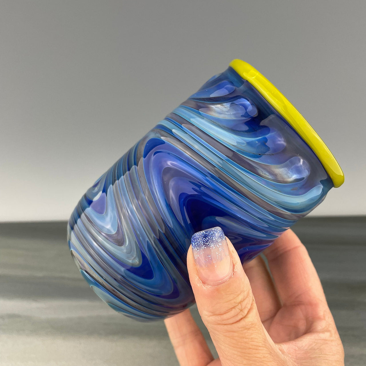 cobalt blue cup with a yellow rim