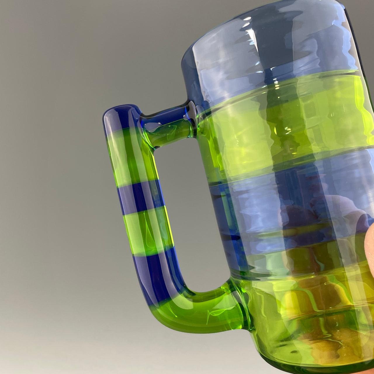 green and blue handle on a mug