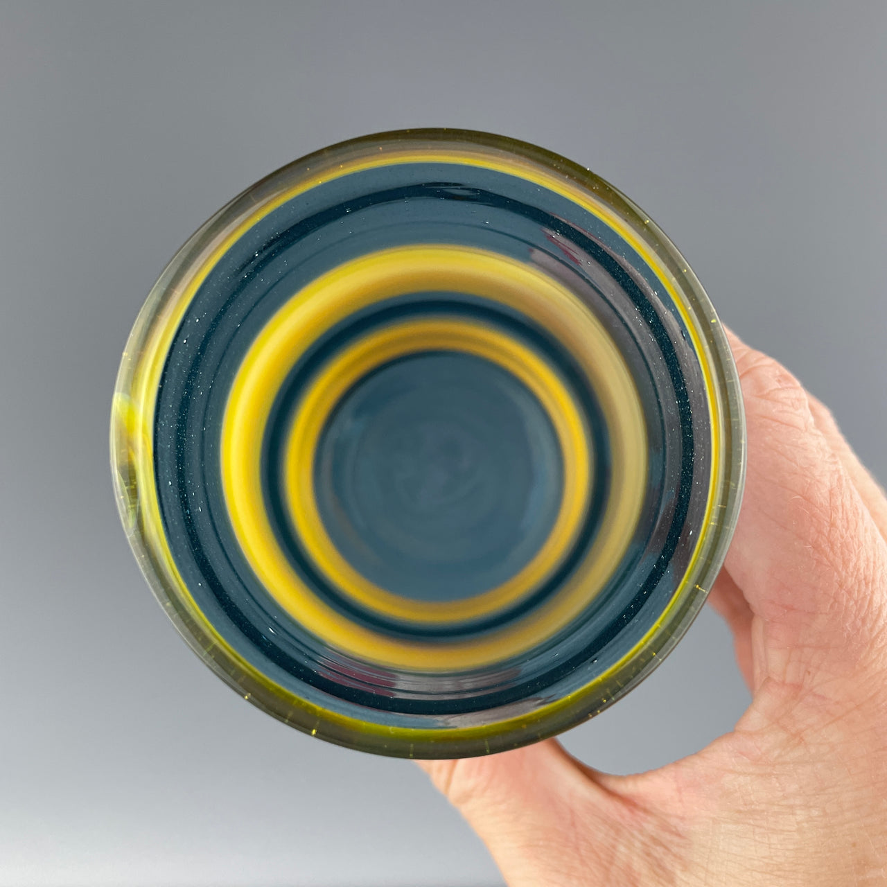 inside of a blue and yellow striped cup