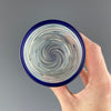 inside of a clear and blue swirls cup