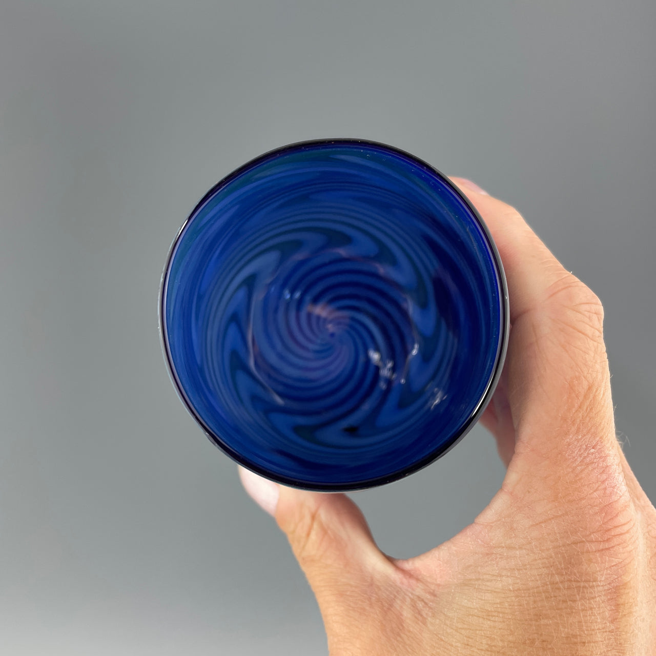 inside of a cobalt blue stemless wineglass