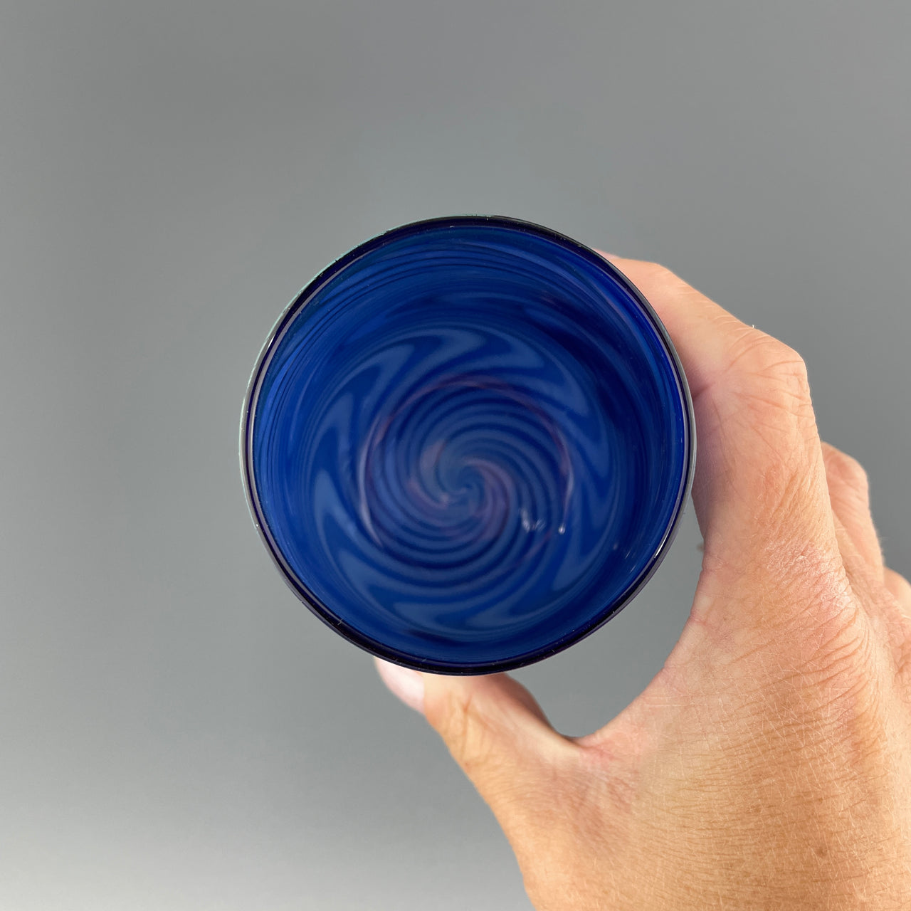 inside of a cobalt blue stemless wineglass