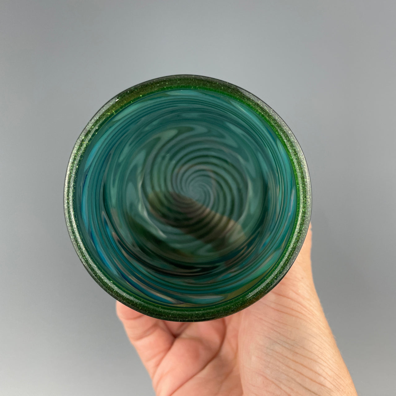 inside of a green and silver cup