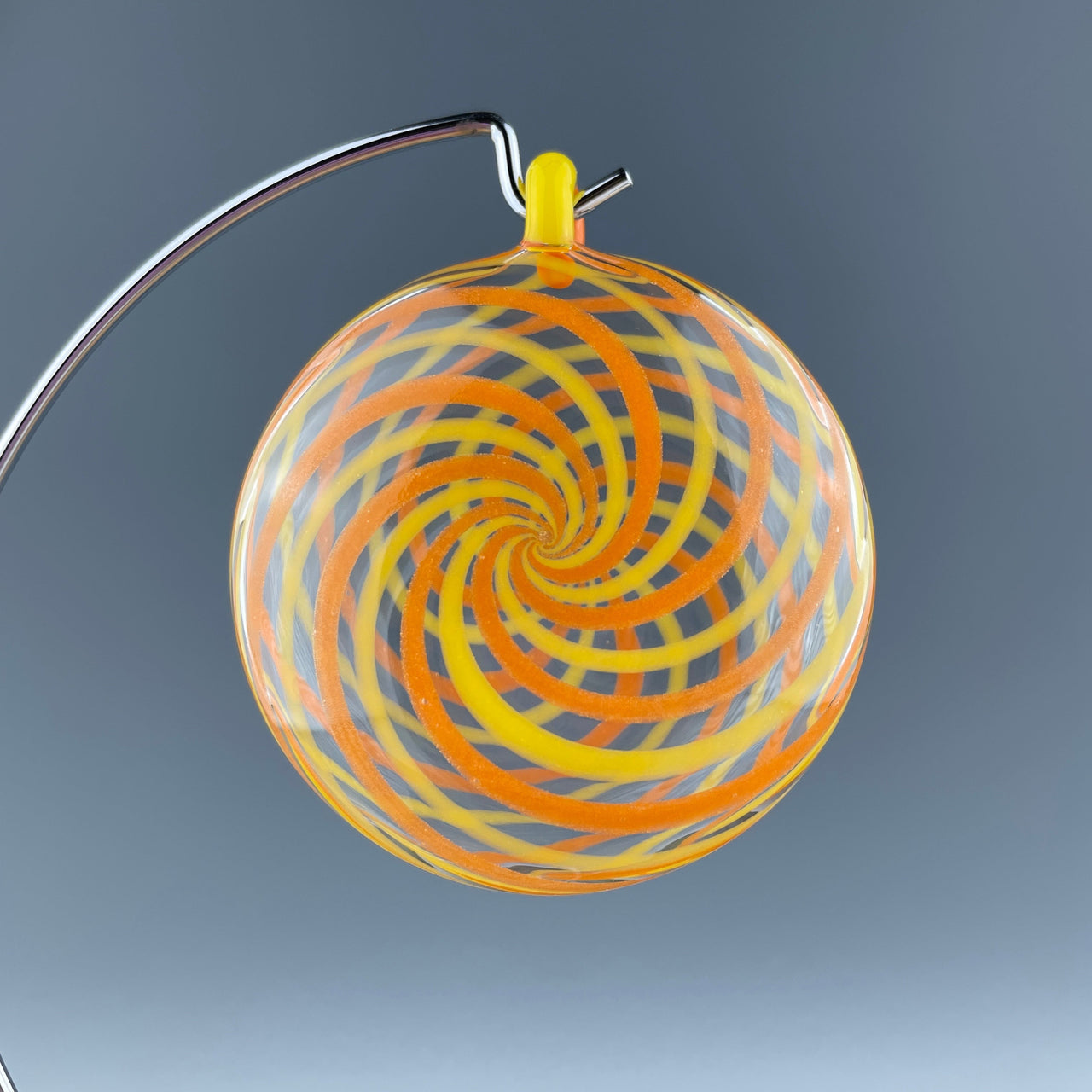 orange swirled disc ornament