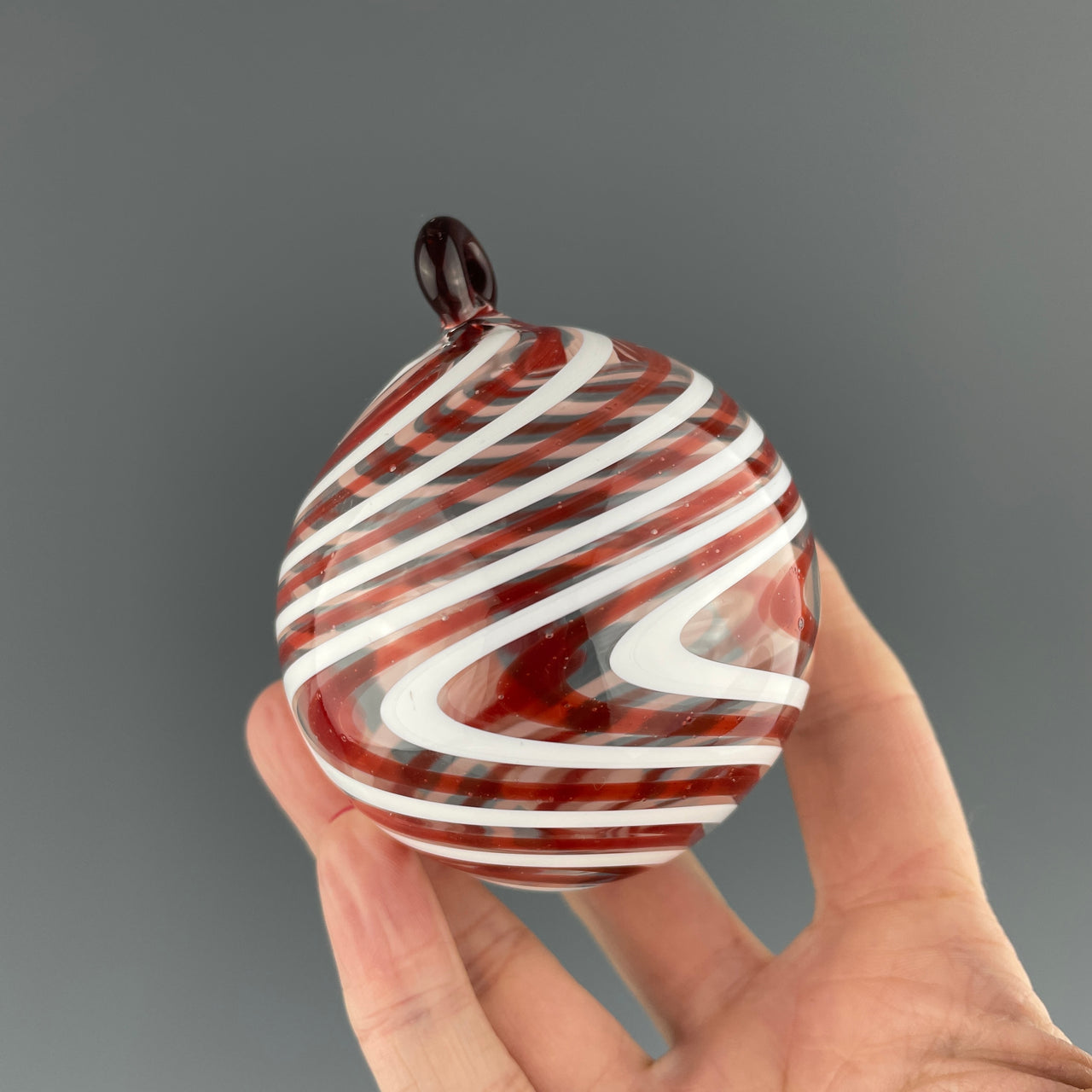 red and white swirled ornament