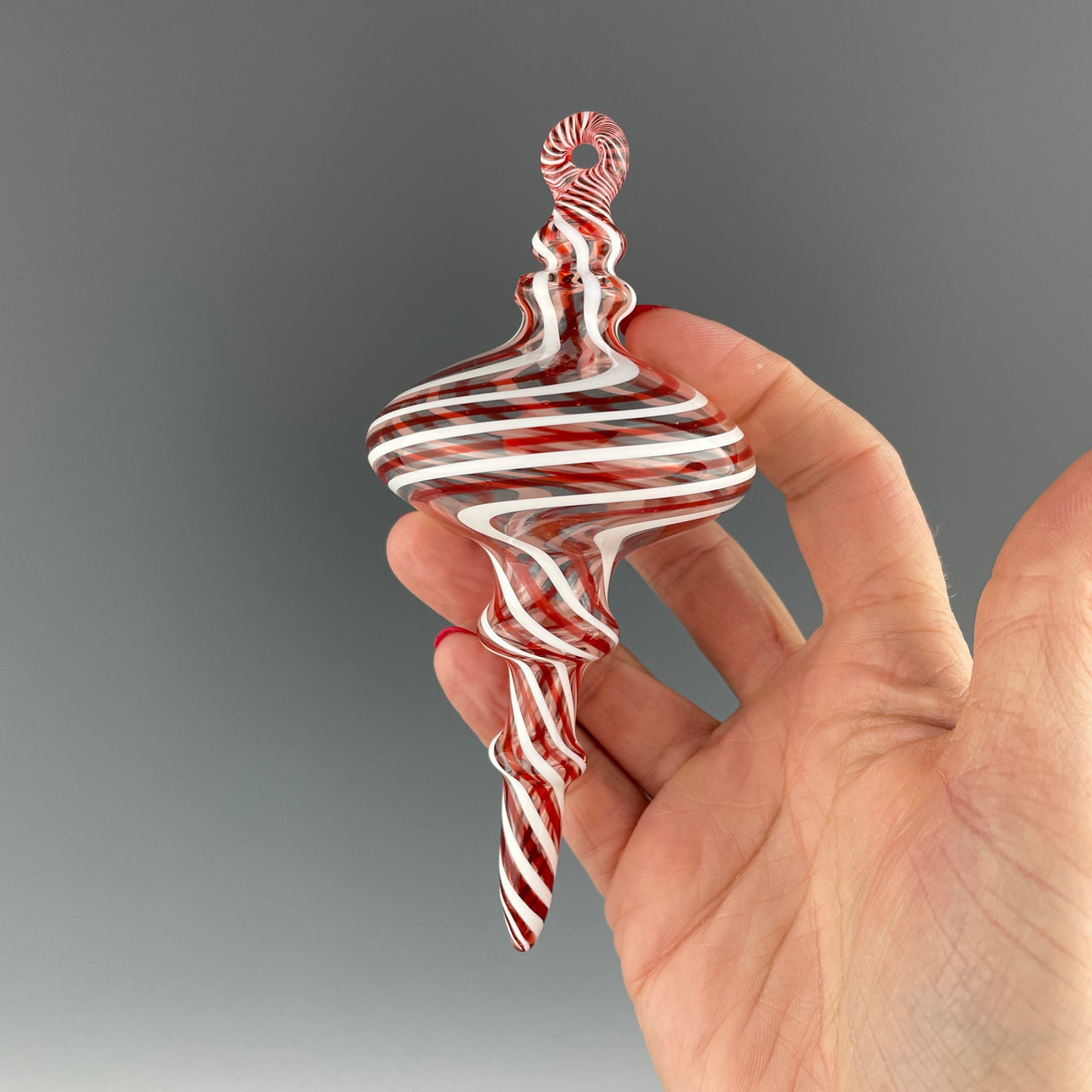 red and white swirled holiday ornament
