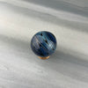 blue and black wig wag hider marble