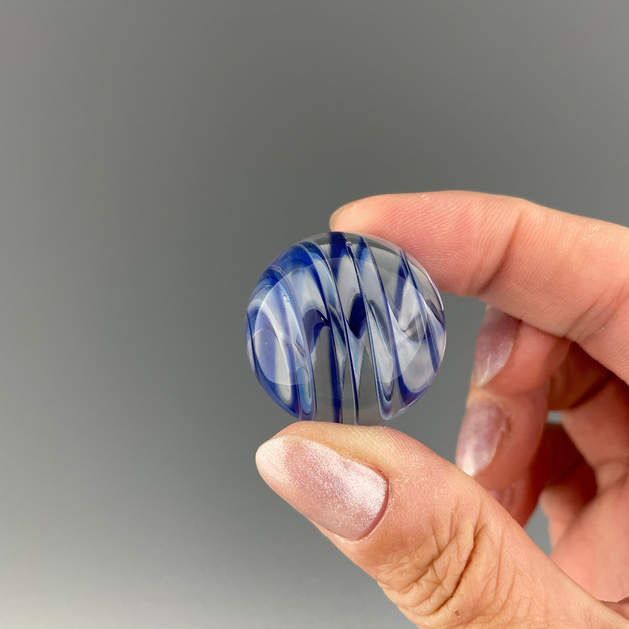 blue and white swirl hider marble